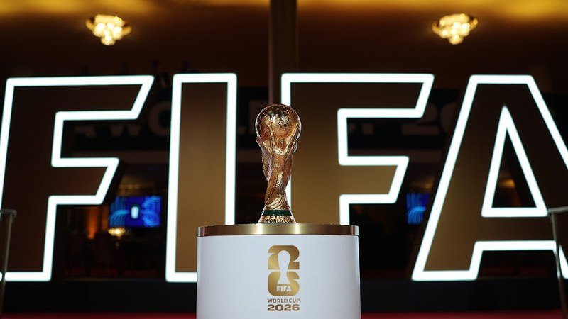 FIFA World Cup 2026 official trophy and stadium branding promotional photography